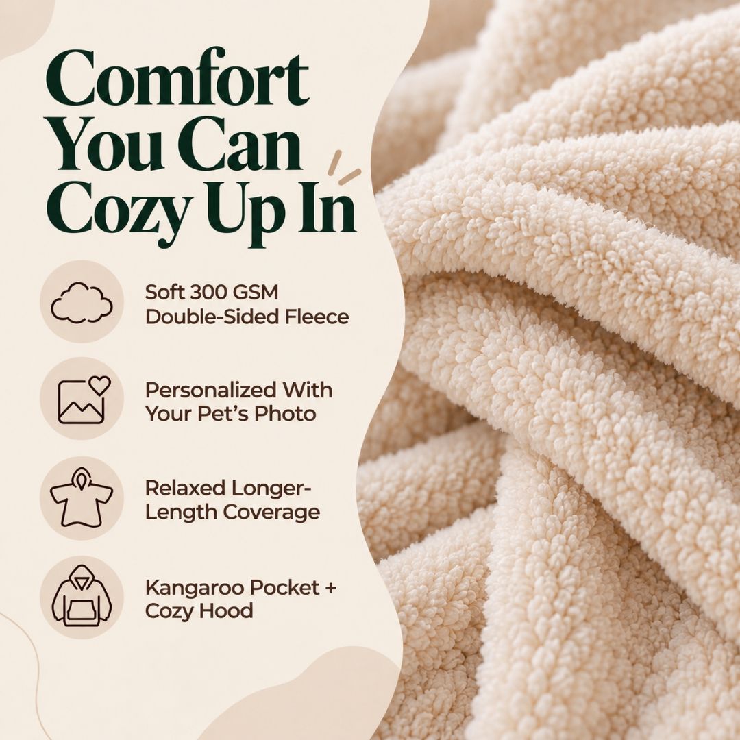 A promotional graphic for a cozy fleece blanket or pet comforter, showing a close-up of soft cream-colored plush fabric on the right and marketing text on the left. The text reads: 'Comfort You Can Cozy Up In' and lists features including soft 300 GSM double-sided fleece, personalized pet photo option, relaxed longer-length coverage, and kangaroo pocket plus cozy hood.