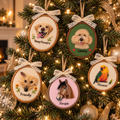 Five personalized wooden Christmas tree ornaments featuring portraits of a golden dog, a poodle, a long-haired cat, a horse, and a colorful parrot, hanging on a decorated Christmas tree with warm lights.